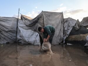 Palestinians suffer flooded tents and debris as cold and rain lash Gaza