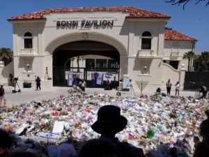 Australia police charge surviving Bondi Beach attacker as first funerals held