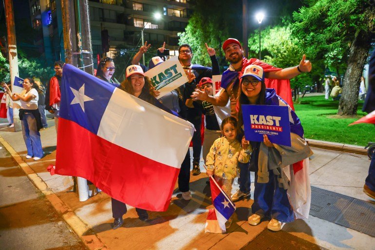SANTIAGO, CHILE - DECEMBER 14: Supporters of Presidential candidate Jose Antonio Kast of the "Partido Republicano" celebrate following the presidential runoff election on December 14, 2025 in Santiago, Chile. According to the Chilean electoral institute 'Servel', Kast has 58.21% of the votes against 41.79% for Jeannette Jara of the Unidad Por Chile coalition, after 98.53% of the polling stations counted in the Presidential election runoff.(Photo by Marcelo Hernandez/Getty Images)