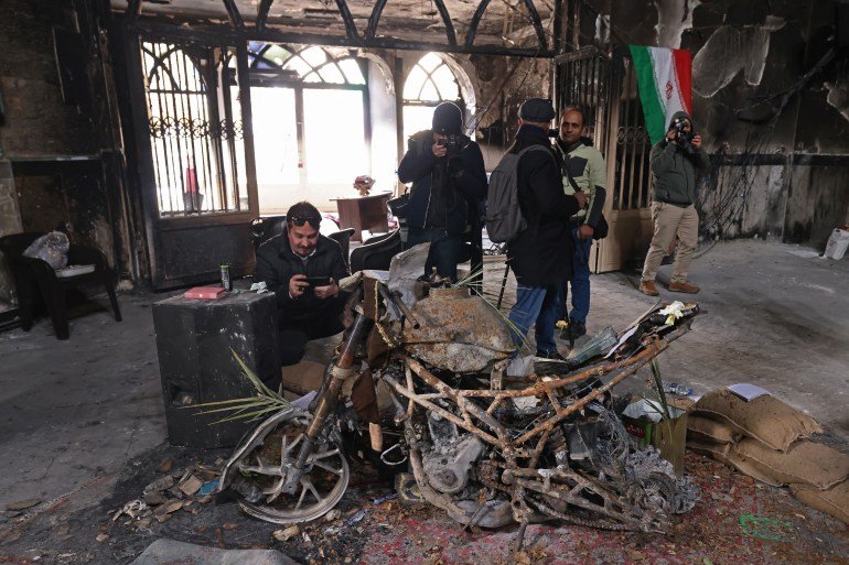 This photograph taken during a tour for foreign media shows media representatives visiting the Beheshti Mosque that was damaged during recent public protests, in Tehran on January 21, 2026.