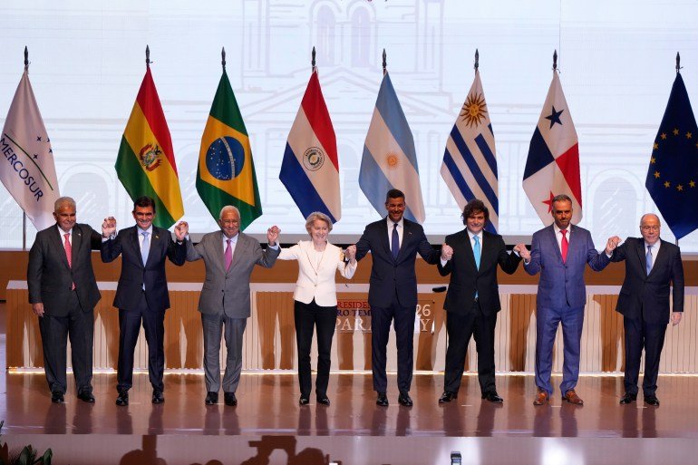 Panama's President Jose Raul Mulino, from left, Bolivian President Rodrigo Paz, European Council President Antonio Costa, European Commission President Ursula von der Leyen, Paraguay's President Santiago Pena, Argentina's President Javier Milei, Uruguay's President Yamandu Orsi and Brazilian Minister of Foreign Affairs Mauro Vieira, pose for a group photo during a meeting to sign a free trade deal between the European Union and Mercosur in Asuncion, Paraguay, Saturday, Jan. 17, 2026. (AP Photo/Jorge Saenz)