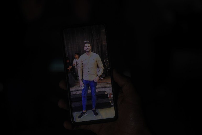 Picture of Abdullah Nattat on a phone standing