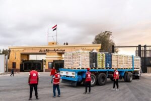 Truck carrying aid enter Gaza through the border crossing on in Rafah, Egypt.