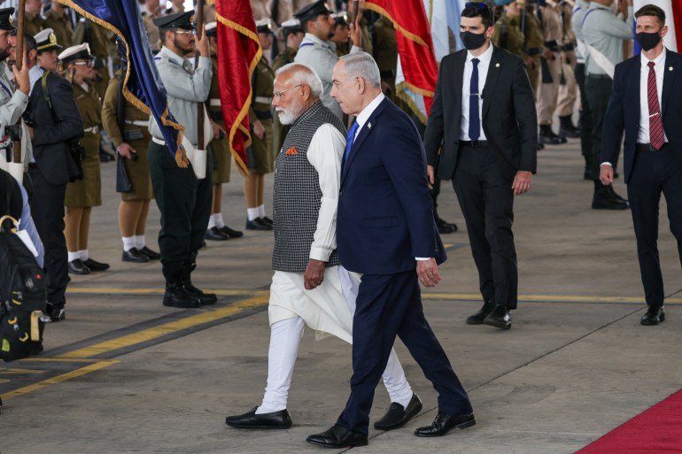 India's Prime Minister Narendra Modi and Israel's Prime Minister Benjamin Netanyahu attend a welcome ceremony upon Modi's arrival at Ben Gurion International Airport in Lod, near Tel Aviv, Israel February 25, 2026. REUTERS/Shir Torem