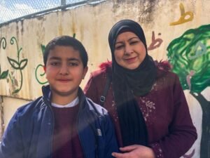 Eman Hassaneh and her 10-year-old son, Zaid [Al Jazeera]