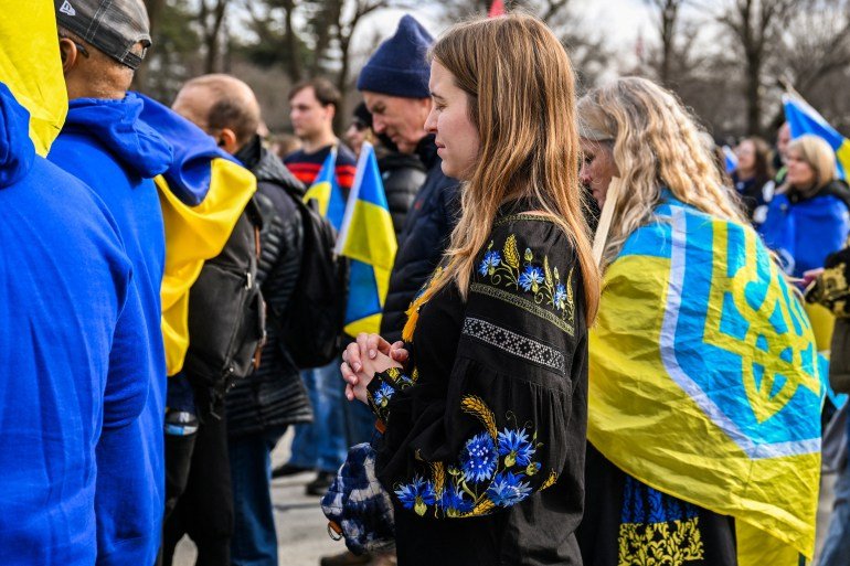 Demonstrators participate in a rally to mark the fourth anniversary of the full-scale Russian invasion of Ukraine, at the Lincoln Memorial in Washington, D.C., U.S., February 21, 2026. REUTERS/Annabelle Gordon