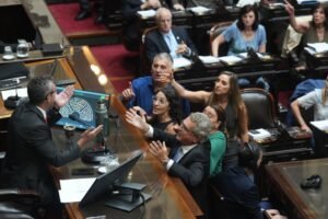 Opposition lawmakers argue with Chamber of Deputies President Martin Menem during debate on a labor reform bill proposed by President Javier Milei's government in Buenos Aires, Argentina