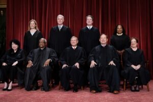 Members of the Supreme Court sit for a new group portrait at the Supreme Court building i