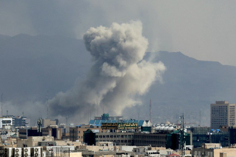 A plume of smoke acends after a military strike on the capital Tehran on March 2, 2026. The Israeli