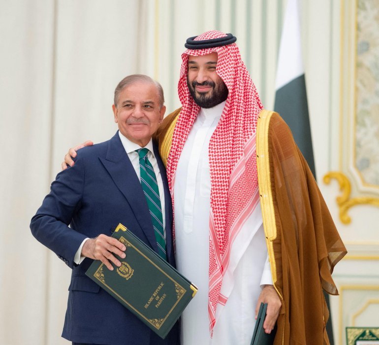 A month after Iranian president's visit to Islamabad, Pakistani PM Shehbaz Sharif met Saudi Crown Prince Mohammed bin Salman in Riyadh in September 2025 to sign a defence agreement. [File: Handout/Saudi Press Agency via Reuters]