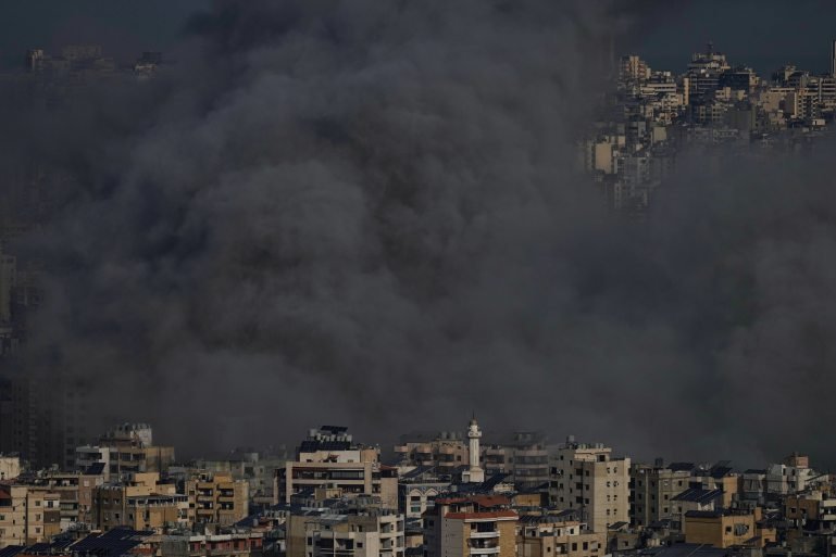 Smoke rises following an Israeli airstrike in Dahiyeh