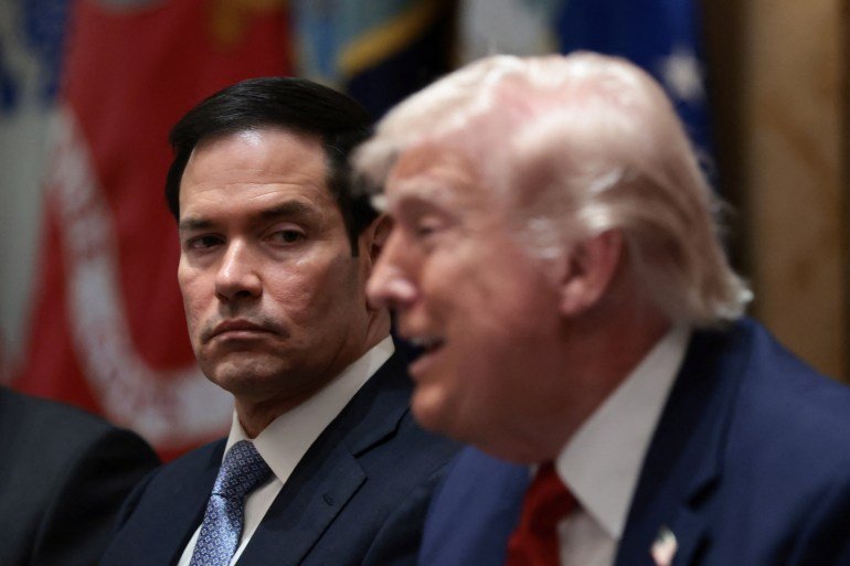 U.S. President Donald Trump speaks next to U.S. Secretary of State Marco Rubio during a cabinet meeting at the White House in Washington, D.C., U.S., March 26, 2026. REUTERS/Evelyn Hockstein