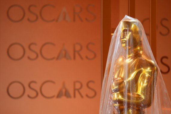 Oscar statue is protected by plastic in the red carpet area, Friday, March 13, 2026, at the Dolby Theatre in Los Angeles in preparation for Sunday's 98th Academy Awards ceremony. (AP Photo/Chris Pizzello)